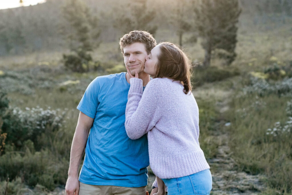 girl kissing a guy in the cheek