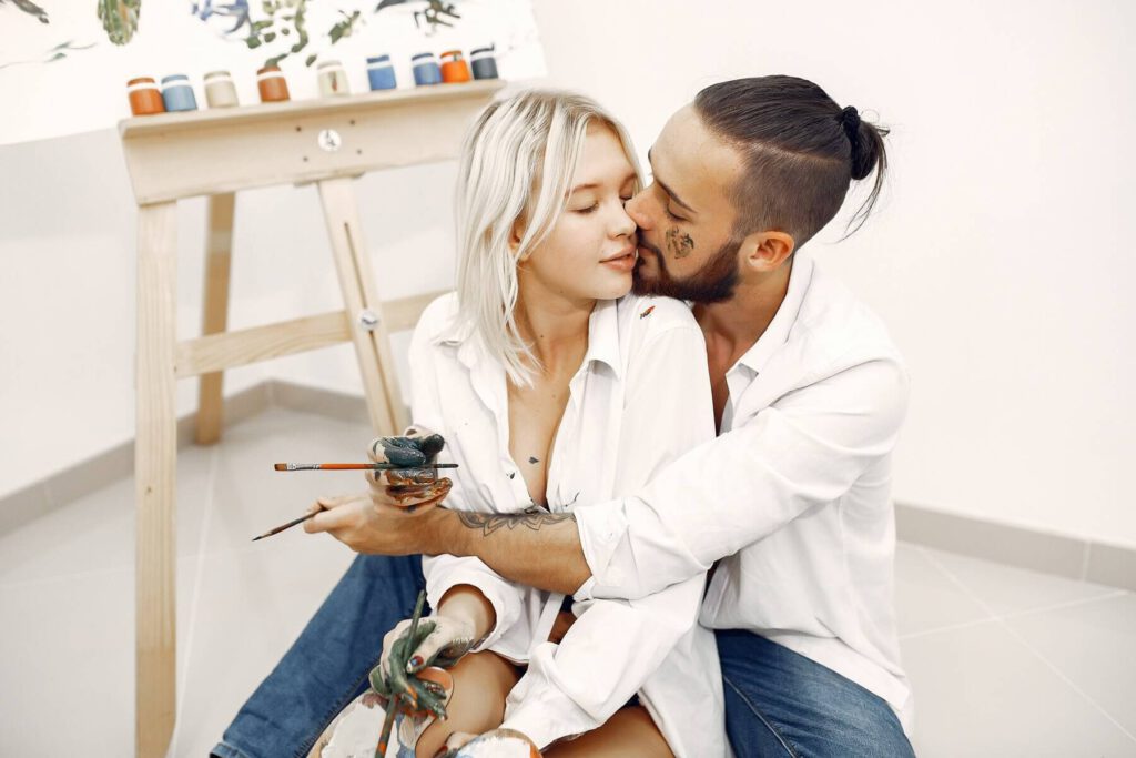 couple painting together in an art studio