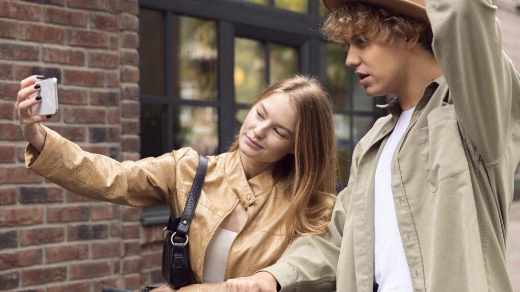 teens on a date taking selfie